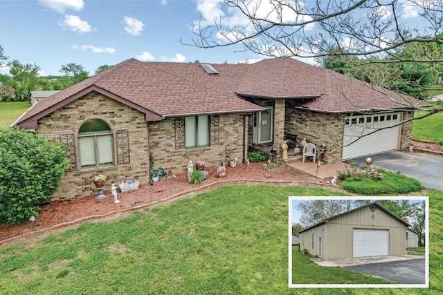 single story home featuring a front yard and a garage