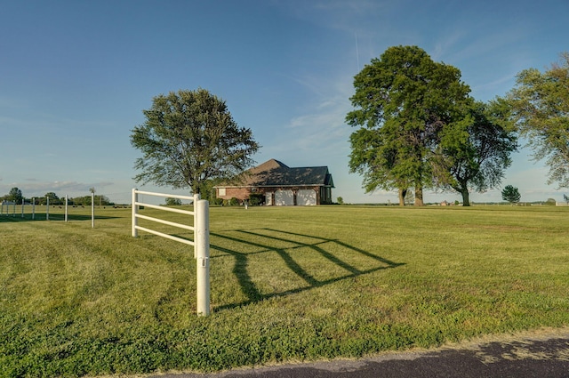 view of yard with a rural view