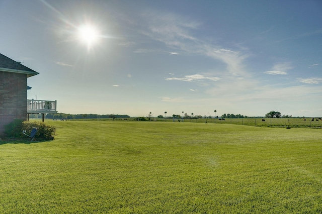 view of yard with a rural view