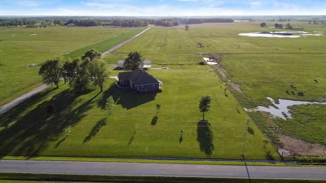 bird's eye view with a water view and a rural view