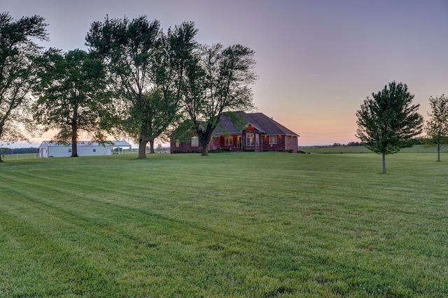 view of yard at dusk