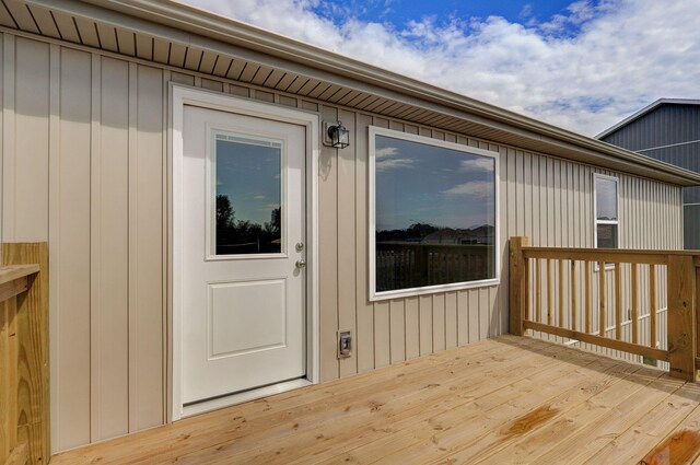 entrance to property with a wooden deck