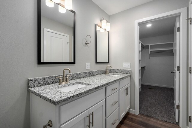 bathroom featuring hardwood / wood-style flooring and vanity