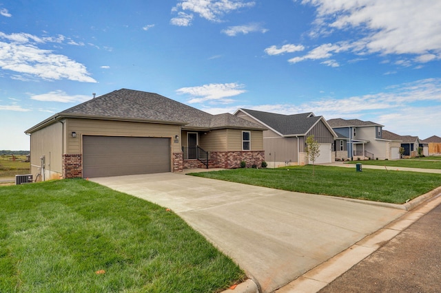 view of front of property with a garage and a front lawn