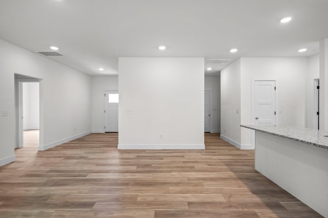 unfurnished living room with light wood-type flooring