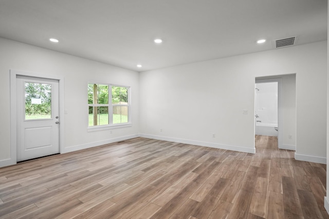 unfurnished room featuring baseboards, visible vents, recessed lighting, and light wood-style floors