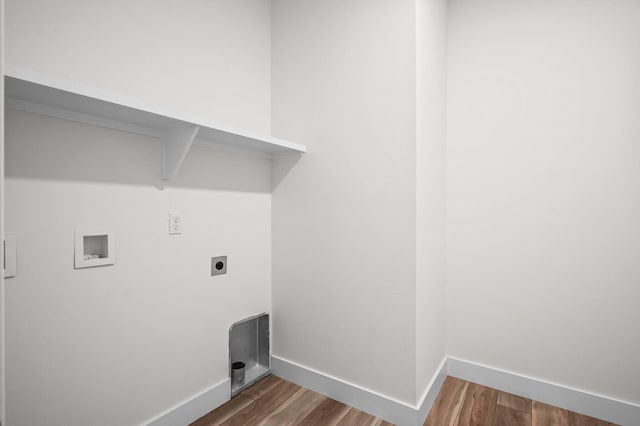 laundry room featuring hookup for a washing machine, wood finished floors, electric dryer hookup, baseboards, and laundry area