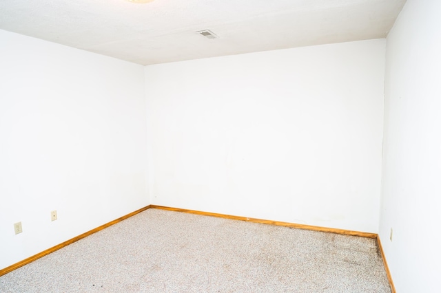 spare room featuring carpet flooring