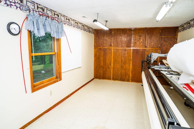 misc room featuring wooden walls