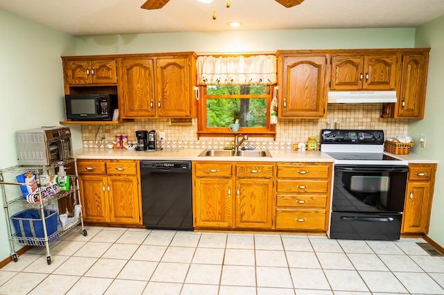 kitchen with black appliances, ceiling fan, sink, and tasteful backsplash