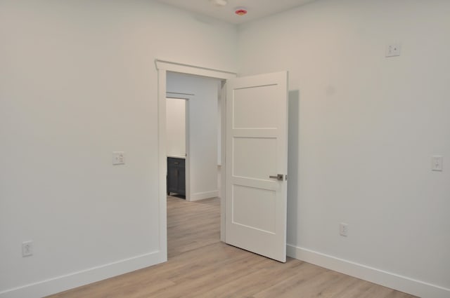 empty room with light wood-type flooring