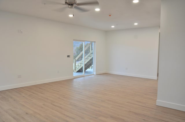 unfurnished room featuring ceiling fan and light wood-type flooring