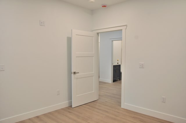 unfurnished room featuring light hardwood / wood-style flooring