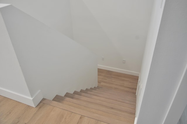 staircase featuring hardwood / wood-style floors