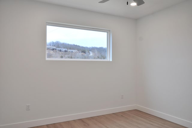 unfurnished room with ceiling fan and light hardwood / wood-style flooring