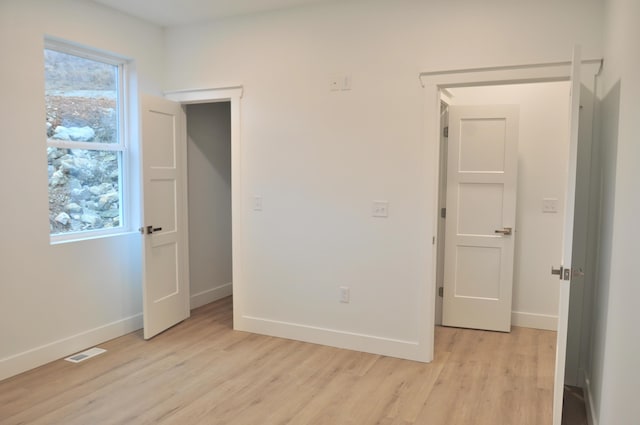 unfurnished bedroom featuring light hardwood / wood-style flooring