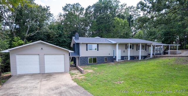 bi-level home with an outdoor structure, a chimney, a front yard, and a detached garage