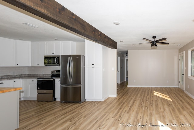 kitchen featuring white cabinets, beam ceiling, tasteful backsplash, stainless steel appliances, and light wood-type flooring