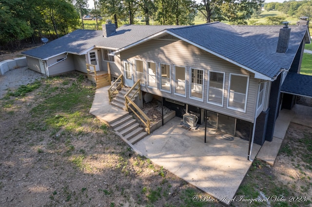 rear view of property with a patio area