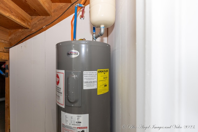 utility room featuring electric water heater