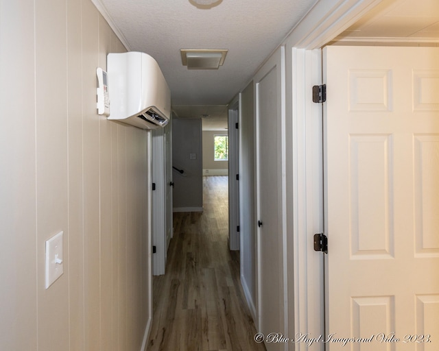 hall with dark wood-type flooring and wooden walls