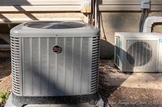 exterior details featuring ac unit, central AC unit, and concrete floors