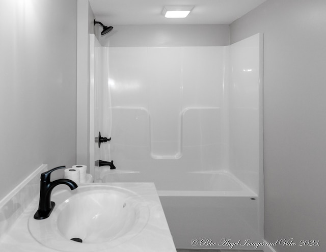 bathroom with shower / bathtub combination and vanity