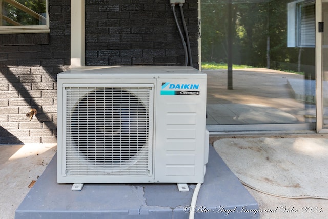 exterior details with ac unit and concrete flooring