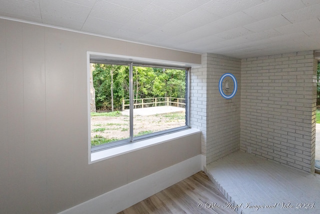 unfurnished room featuring hardwood / wood-style flooring