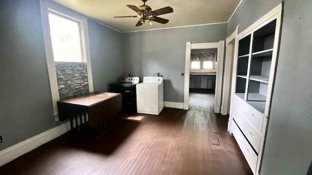 laundry area featuring ceiling fan, dark hardwood / wood-style flooring, a wealth of natural light, and washer and clothes dryer