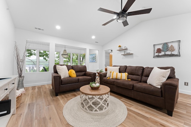 living room with vaulted ceiling, light wood-type flooring, and ceiling fan