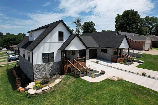 modern farmhouse with a garage and a front lawn