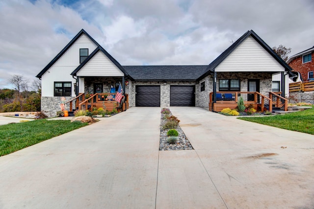 view of front of house with a garage and a porch