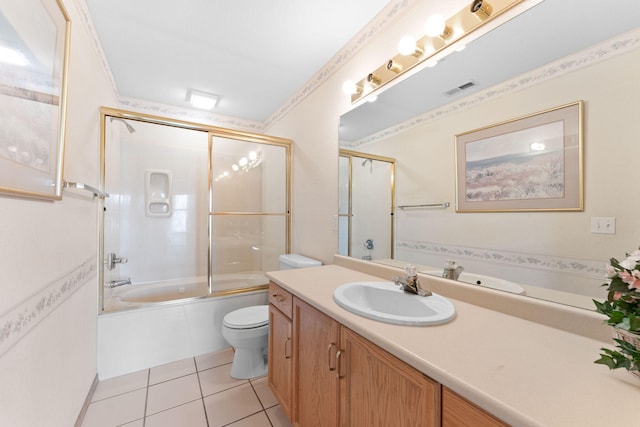 full bathroom featuring tile patterned flooring, vanity, toilet, and enclosed tub / shower combo