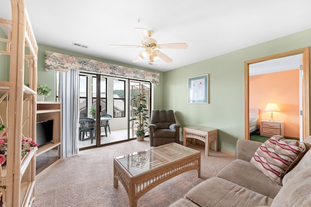 living room featuring ceiling fan and light carpet