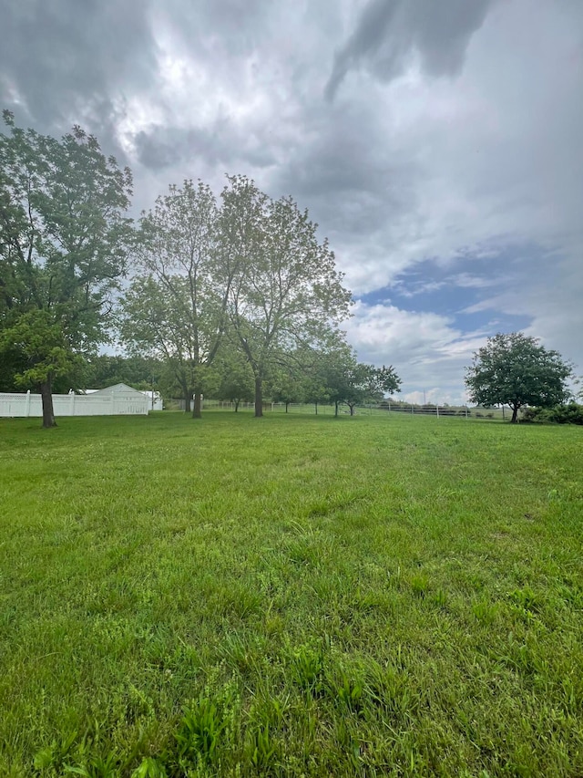 view of yard with a rural view