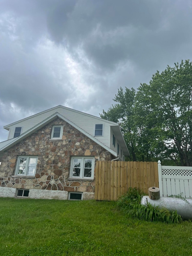 view of home's exterior featuring a yard