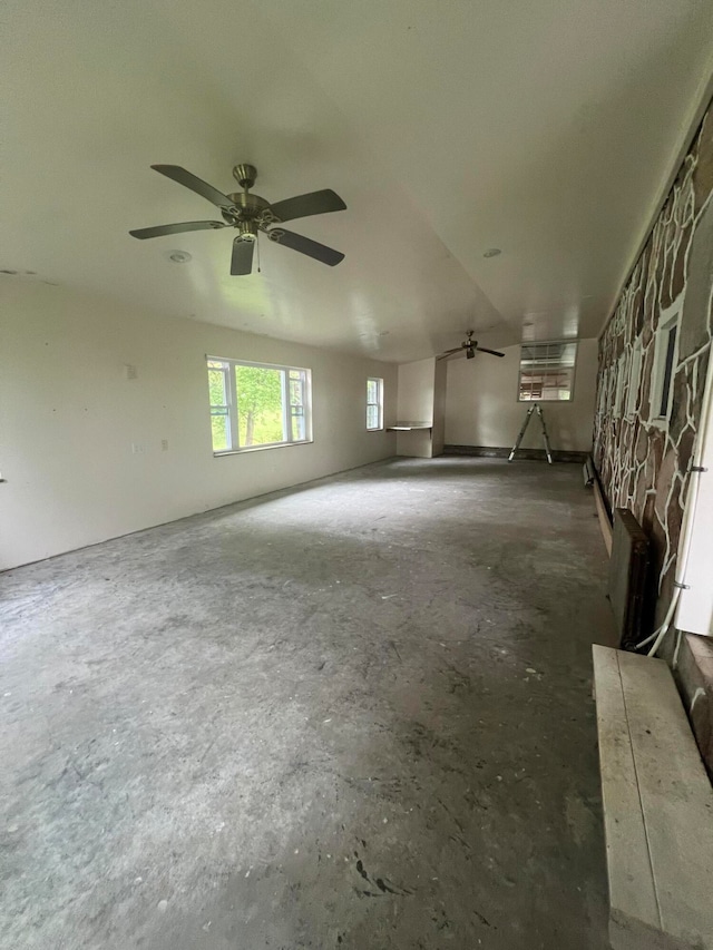 unfurnished room with vaulted ceiling and ceiling fan