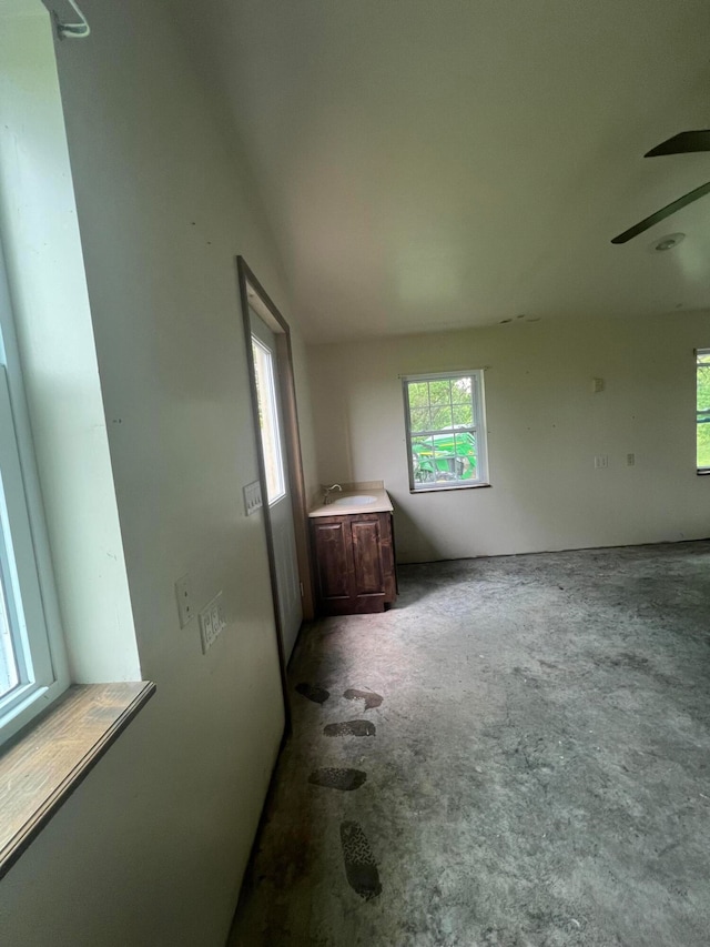 unfurnished room featuring sink and ceiling fan