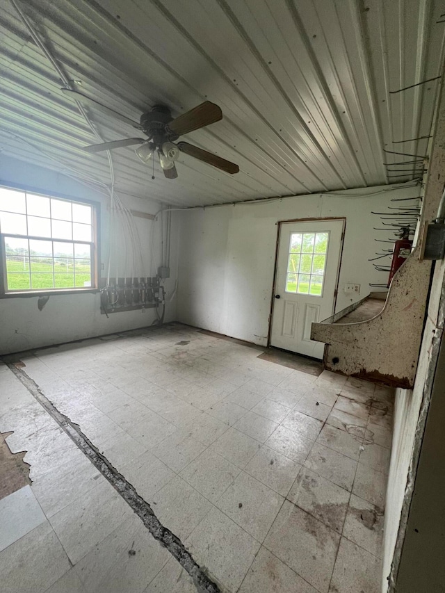 unfurnished room with ceiling fan