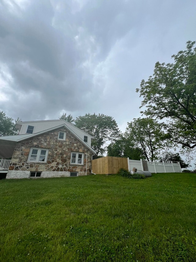 view of property exterior featuring a yard