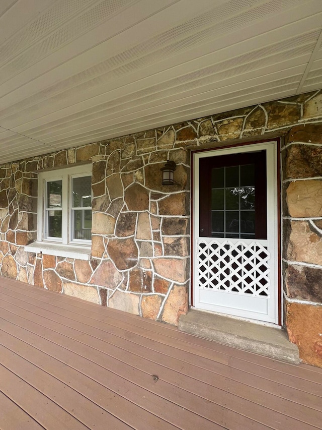 entrance to property with a wooden deck