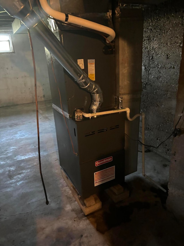 utility room with heating unit