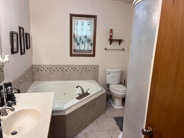 bathroom with vanity, a relaxing tiled tub, tile patterned flooring, and toilet