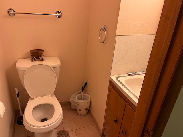 bathroom with tile patterned floors, toilet, and vanity