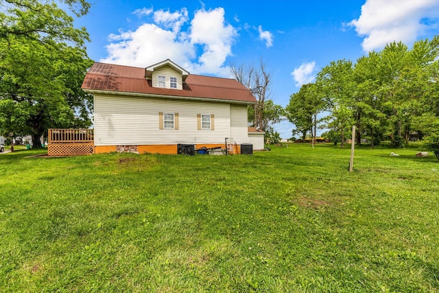 view of home's exterior featuring a yard and a deck