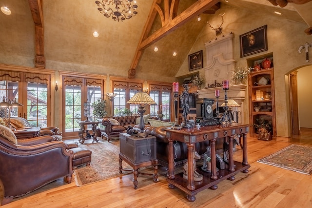 living room featuring beamed ceiling, high vaulted ceiling, and hardwood / wood-style flooring