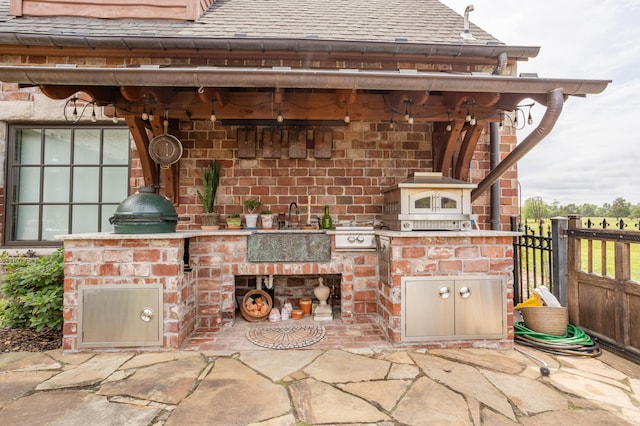 view of patio featuring sink and exterior kitchen