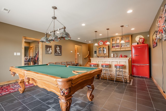 rec room with bar area, dark tile patterned flooring, and pool table