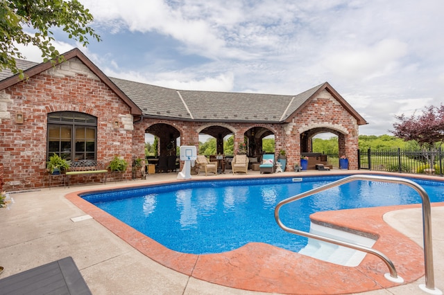 view of pool featuring a patio area